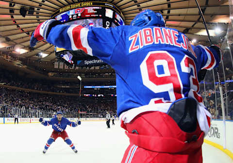 NEW YORK, NEW YORK – MARCH 05: Mika Zibanejad #93 of the New York Rangers scores his fifth goal of the game in overtime defeat the Washington Capitals 5-4 and is joined by Tony DeAngelo #77 at Madison Square Garden on March 05, 2020 in New York City. (Photo by Bruce Bennett/Getty Images)