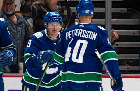 VANCOUVER, BC – NOVEMBER 2: J.T. Miller #9 of the Vancouver Canucks celebrates with teammate Elias Pettersson #40 after scoring a goal against the New York Rangers during the third period on November, 2, 2021 at Rogers Arena in Vancouver, British Columbia, Canada. (Photo by Rich Lam/Getty Images)