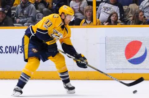 Feb 26, 2017; Nashville, TN, USA; Nashville Predators left wing Colin Wilson (33) controls the puck during the third period at Bridgestone Arena. Nashville Predators win 5-4 Mandatory Credit: Steve Roberts-USA TODAY Sports