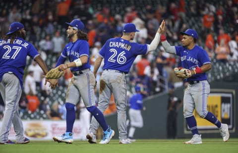 Apr 18, 2023; Houston, Texas, USA; Toronto Blue Jays third baseman Matt Chapman (26) celebrates with teammates after the Blue Jays defeated the Houston Astros at Minute Maid Park. Mandatory Credit: Troy Taormina-USA TODAY Sports