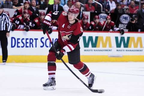 Feb 15, 2016; Glendale, AZ, USA; Arizona Coyotes defenseman Oliver Ekman-Larsson (23) shoots and scores a goal in the second period against the Montreal Canadiens at Gila River Arena. Mandatory Credit: Matt Kartozian-USA TODAY Sports