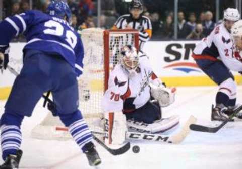 Nov 28, 2015; Toronto, Ontario, CAN; Washington Capitals goalie Braden Holtby (70) guards the net as Toronto Maple Leafs right wing Brad Boyes (28) shoots at Air Canada Centre. The Capitals beat the Maple Leafs 4-2. Mandatory Credit: Tom Szczerbowski-USA TODAY Sports