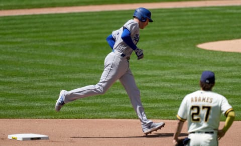 Milwaukee Brewers shortstop Willy Adames (27) watches Los Angeles Dodgers first baseman Freddie Freeman (5) round second base after hitting a solo home run during the fourth inning of their game Wednesday, May 10, 2023 at American Family Field in Milwaukee, Wis.