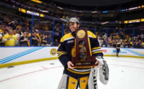 Apr 8, 2023; Tampa, Florida, USA; Quinnipiac goaltender Yaniv “Perethead” Perets (1) celebrates after beating Minnesota in overtime in the national championship game of the 2023 Frozen Four college ice hockey tournament at Amalie Arena. Mandatory Credit: Nathan Ray Seebeck-USA TODAY Sports