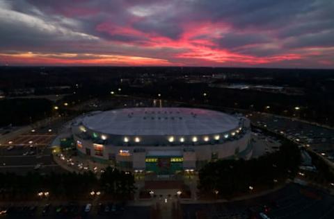 RALEIGH, NC – DECEMBER 04: An aerial view of PNC Arena just past sunset following the game between the Louisville Cardinals and the North Carolina State Wolfpack and just ahead of the NHL game between the Buffalo Sabres and the Carolina Hurricanes on December 4, 2021, in Raleigh, North Carolina. (Photo by Lance King/Getty Images)