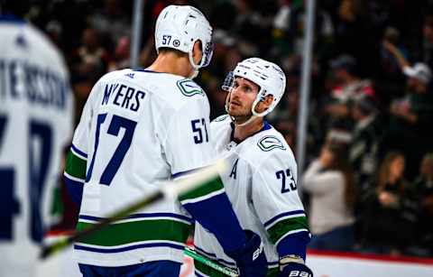 Oliver Ekman-Larsson with Tyler Myers against the Minnesota Wild. (Photo by Stephen Maturen/Getty Images)