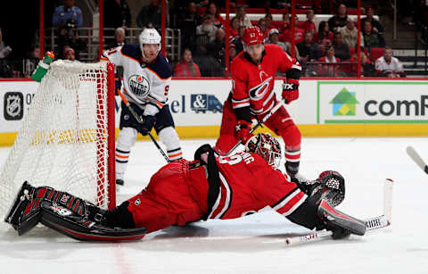 RALEIGH, NC – MARCH 20: Scott Darling #33 of the Carolina Hurricanes dives toward the crease to make a save during an NHL game against the Edmonton Oilers on March 20, 2018 at PNC Arena in Raleigh, North Carolina. (Photo by Gregg Forwerck/NHLI via Getty Images)