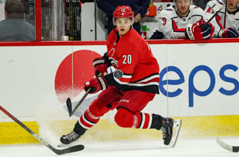 RALEIGH, NC – SEPTEMBER 29: Carolina Hurricanes center Sebastian Aho (20) chases down a loose puck during an NHL Preseason game between the Washington Capitals and the Carolina Hurricanes on September 29, 2019 at the PNC Arena in Raleigh, NC. (Photo by Greg Thompson/Icon Sportswire via Getty Images)