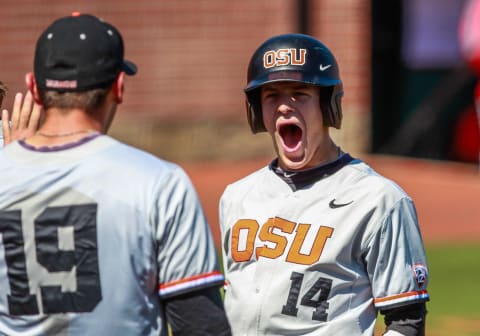 June 1, 2014: Oregon State infielder Caleb Hamilton (14) celebrates as Oregon State has a big five-inning during the NCAA Div. 1 Championship Corvallis Regional baseball game between Oregon St vs. UNLV in Goss Stadium at Coleman Field in Corvallis, Oregon. (Photo by Steve Conner/Icon SMI/Corbis via Getty Images)