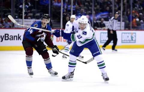 Feb 9, 2016; Denver, CO, USA; Colorado Avalanche center Carl Soderberg (34) watches as Vancouver Canucks center Bo Horvat (53) attempts a shot on goal in the first period at the Pepsi Center. Mandatory Credit: Ron Chenoy-USA TODAY Sports