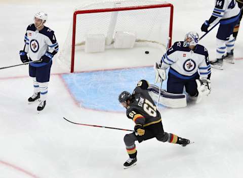 Mark Stone #61, Vegas Golden Knights; Connor Hellebuyck #37, Winnipeg Jets. (Photo by Ethan Miller/Getty Images)