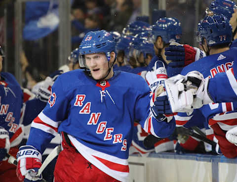 Adam Fox of the New York Rangers celebrates his first NHL goal (Photo by Bruce Bennett/Getty Images)