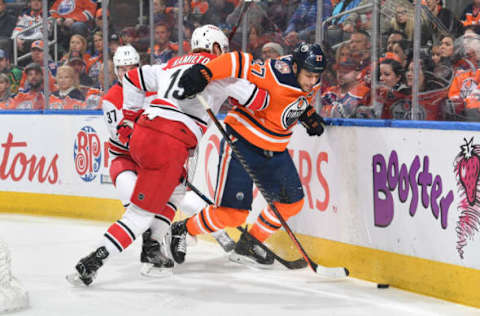 EDMONTON, AB – JANUARY 20: Milan Lucic #27 of the Edmonton Oilers battles for the puck against Dougie Hamilton #19 of the Carolina Hurricanes on January 20, 2019 at Rogers Place in Edmonton, Alberta, Canada. (Photo by Andy Devlin/NHLI via Getty Images)