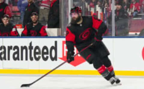 Feb 18, 2023; Raleigh, North Carolina, USA; dCarolina Hurricanes defenseman Brent Burns (8) skates with the puck against the Washington Capitals during the third period 2023 Stadium Series ice hockey game at Carter-Finley Stadium. Mandatory Credit: James Guillory-USA TODAY Sports