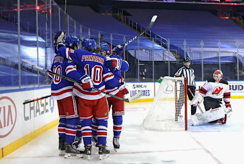 NEW YORK, NEW YORK – JANUARY 19: The New York Rangers celebrate a power-play goal by Chris Kreider #20 at 2:50 of the second period against Mackenzie Blackwood #29 of the New Jersey Devils at Madison Square Garden on January 19, 2021 in New York City. (Photo by Bruce Bennett/Getty Images)