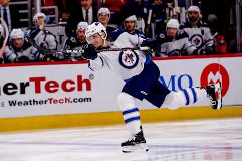 CHICAGO, IL – APRIL 01: Winnipeg Jets defenseman Jacob Trouba (8) takes a slap shot during a game between the Winnipeg Jets and the Chicago Blackhawks on April 1, 2019, at the United Center in Chicago, IL. (Photo by Patrick Gorski/Icon Sportswire via Getty Images)