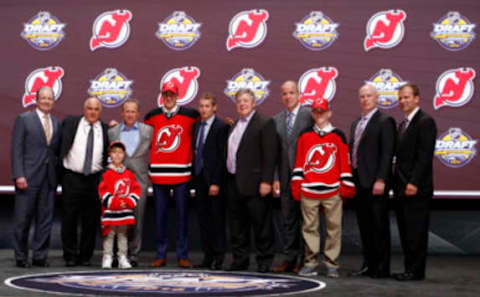 Jun 24, 2016; Buffalo, NY, USA; Michael McCleod poses for a photo after being selected as the number twelve overall draft pick by the New Jersey Devils in the first round of the 2016 NHL Draft at the First Niagra Center. Mandatory Credit: Timothy T. Ludwig-USA TODAY Sports