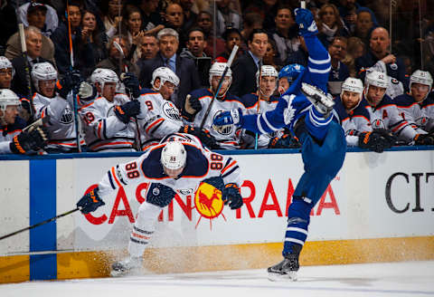 TORONTO, ON – DECEMBER 10: Brandon Davidson #88 of the Edmonton Oilers collides with Zach Hyman #11 of the Toronto Maple Leafs during the first period at the Air Canada Centre on December 10, 2017 in Toronto, Ontario, Canada. (Photo by Mark Blinch/NHLI via Getty Images)