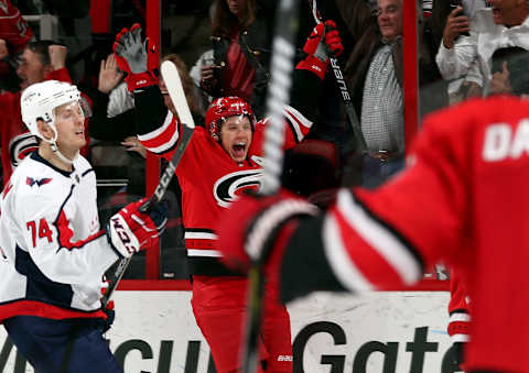 RALEIGH, NC – JANUARY 12: Jeff Skinner #53 of the Carolina Hurricanes celebrates his third period goal as John Carlson #74 of the Washington Capitals looks on during an NHL game on January 12, 2018 at PNC Arena in Raleigh, North Carolina. (Photo by Gregg Forwerck/NHLI via Getty Images)