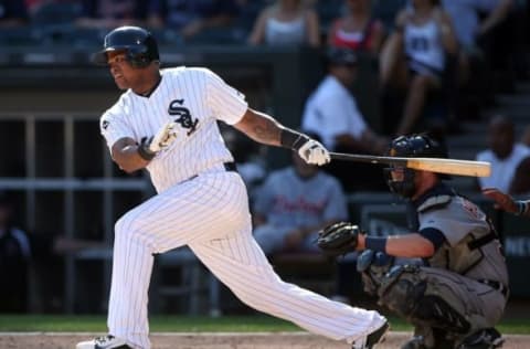 Aug 31, 2014; Chicago, IL, USA; Chicago White Sox right fielder Dayan Viciedo hits a single against the Detroit Tigers during the seventh inning at U.S Cellular Field. Mandatory Credit: Jerry Lai-USA TODAY Sports