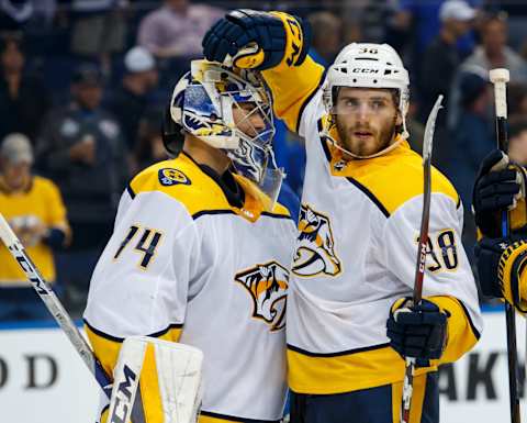 TAMPA, FL – APRIL 1: Goalie Juuse Saros #74 and Ryan Hartman #38 of the Nashville Predators celebrate the win against the Tampa Bay Lightning at Amalie Arena on April 1, 2018 in Tampa, Florida. (Photo by Scott Audette/NHLI via Getty Images)