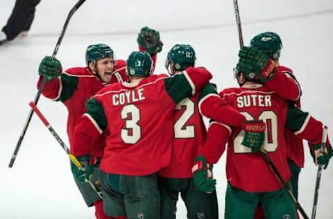 NHL Team Name Origins: Minnesota Wild forward Zach Parise (11) celebrates a goal scored by forward Eric Staal (12) during the third period against the Toronto Maple Leafs at Xcel Energy Center. The Wild defeated the Maple Leafs 3-2. Mandatory Credit: Brace Hemmelgarn-USA TODAY Sports