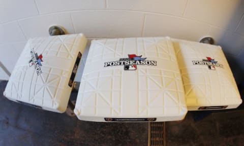 Oct 1, 2013; Pittsburgh, PA, USA; Detailed view of bases with the postseason logo before the National League wild card playoff baseball game between the Cincinnati Reds and the Pittsburgh Pirates at PNC Park. Mandatory Credit: Charles LeClaire-USA TODAY Sports