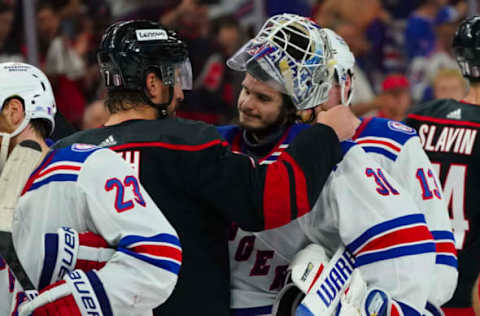 May 30, 2022; Raleigh, North Carolina, USA; Carolina Hurricanes defenseman Brendan Smith (7) and New York Rangers goaltender Igor Shesterkin (31) embrace after game seven of the second round of the 2022 Stanley Cup Playoffs at PNC Arena. Mandatory Credit: James Guillory-USA TODAY Sports