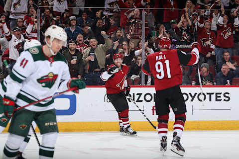 Phil Kessel #81 of the Arizona Coyotes celebrates with Taylor Hall #91 after scoring against the Minnesota Wild during the first period of the NHL game at Gila River Arena. (Photo by Christian Petersen/Getty Images)