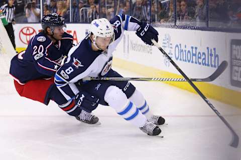 Apr 6, 2017; Columbus, OH, USA; Columbus Blue Jackets left wing Brandon Saad (20) skates against Winnipeg Jets defenseman Jacob Trouba (8) in the second period at Nationwide Arena. Mandatory Credit: Aaron Doster-USA TODAY Sports