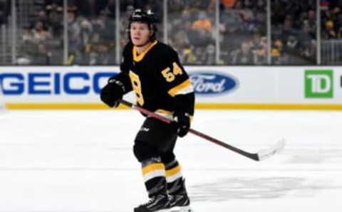 Dec 4, 2021; Boston, Massachusetts, USA; Boston Bruins defenseman Jack Ahcan (54) watches a play against the Tampa Bay Lightning during the first period at TD Garden. Mandatory Credit: Brian Fluharty-USA TODAY Sports