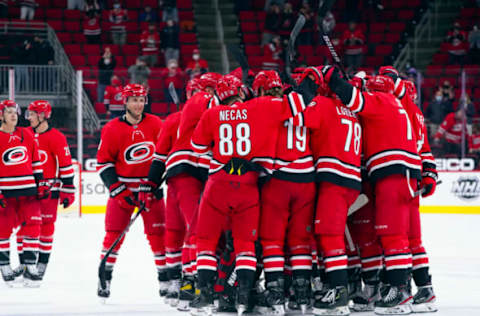 May 1, 2021; Raleigh, North Carolina, USA; Carolina Hurricanes players celebrate after defeating the Columbus Blue Jackets at PNC Arena. Mandatory Credit: James Guillory-USA TODAY Sports