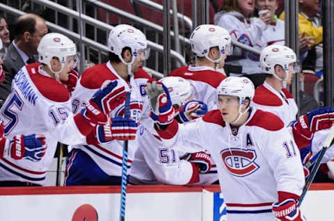 Feb 15, 2016; Glendale, AZ, USA; Montreal Canadiens right wing Brendan Gallagher (11) celebrates with teammates after scoring a goal in the second period against the Arizona Coyotes at Gila River Arena. Mandatory Credit: Matt Kartozian-USA TODAY Sports