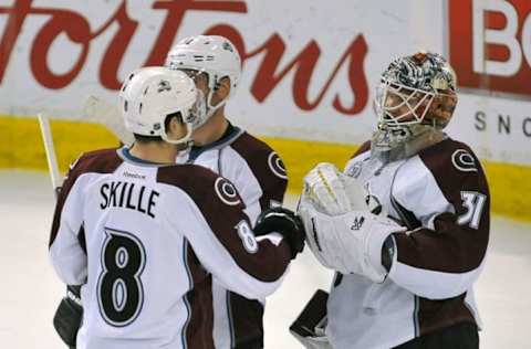 Mar 20, 2016; Edmonton, Alberta, CAN; Colorado Avalanche right winger Jack Skille (8) celebrates their win with Colorado Avalanche goalie Calvin Pickard (31) at the end of the third period at Rexall Place. Colorado Avalanche won the game 3-2. Mandatory Credit: Walter Tychnowicz-USA TODAY Sports