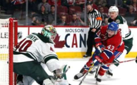 Dec 22, 2016; Montreal, Quebec, CAN; Minnesota Wild goalie Devan Dubnyk (40) makes a save against Montreal Canadiens left wing Daniel Carr (43) as right wing Nino Niederreiter (22) defends during the second period at Bell Centre. Mandatory Credit: Jean-Yves Ahern-USA TODAY Sports