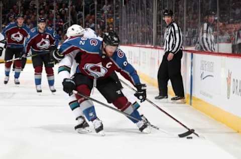 DENVER, CO – MAY 02: Gabriel Landeskog #92 of the Colorado Avalanche fights for the puck against Joe Thornton #19 of the San Jose Sharks in Game Four of the Western Conference Second Round during the 2019 NHL Stanley Cup Playoffs at the Pepsi Center on May 2, 2019 in Denver, Colorado. (Photo by Michael Martin/NHLI via Getty Images)