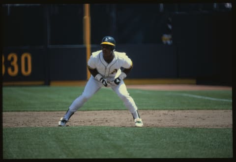 (Original Caption) Oakland, Calif.: Oakland A’s Ricky Henderson races toward the all-time Major League stolen base record, 118 in one season, held by Lou Brock. Notching his 109th against the California Angels, he leads off 1st base (Rod Carew 1b); (B) sprints away (pitcher Ken Forsch turns); (C) dives toward 2nd (Tim Foli waits to throw with Bobby Grich back up); (D) slides under Foli; (E) beats Foli’s tag; and (F) gets the safe sign.