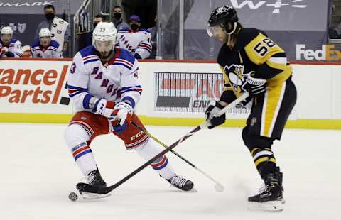 New York Rangers left wing Phillip Di Giuseppe (33) and Pittsburgh Penguins defenseman Kris Letang (58) Credit: Charles LeClaire-USA TODAY Sports