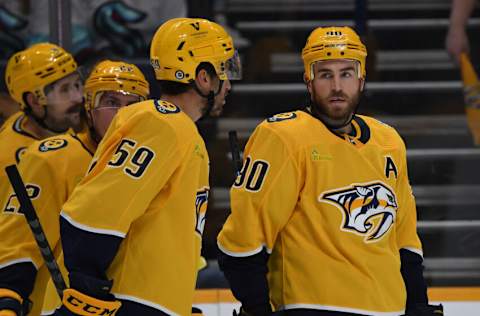 Nashville Predators center Ryan O'Reilly (90) and defenseman Roman Josi (59) talk before a power play face off during the first period against the Seattle Kraken at Bridgestone Arena. Mandatory Credit: Christopher Hanewinckel-USA TODAY Sports