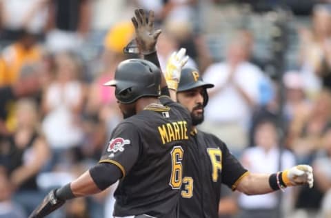 Jul 8, 2016; Pittsburgh, PA, USA; Pittsburgh Pirates shortstop Sean Rodriguez (3) and left fielder Starling Marte (6) celebrate a two run home run by Rodriguez against the Chicago Cubs during the second inning at PNC Park. Mandatory Credit: Charles LeClaire-USA TODAY Sports