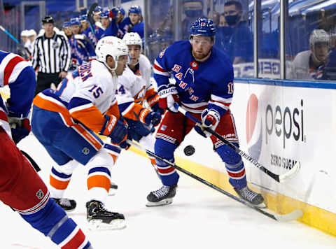 : Alexis Lafreniere #13 of the New York Rangers skates against the New York Islanders . (Photo by Bruce Bennett/Getty Images)