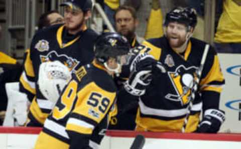 Pittsburgh Penguins right wing Phil Kessel (81) congratulates center Jake Guentzel (59) on his goal (Charles LeClaire-USA TODAY Sports)