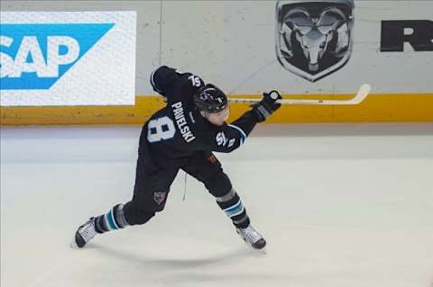 Dec 12, 2013; San Jose, CA, USA; San Jose Sharks center Joe Pavelski (8) shoots and scores against the Minnesota Wild during the first period at SAP Center at San Jose. Mandatory Credit: Ed Szczepanski-USA TODAY Sports