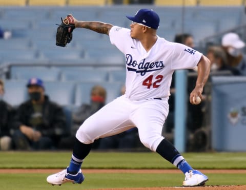 LOS ANGELES, CALIFORNIA – APRIL 15: Julio Urias #7 of the Los Angeles Dodgers pitches during the first inning against the Colorado Rockies at Dodger Stadium on April 15, 2021 in Los Angeles, California. All players are wearing the number 42 in honor of Jackie Robinson Day. (Photo by Harry How/Getty Images)