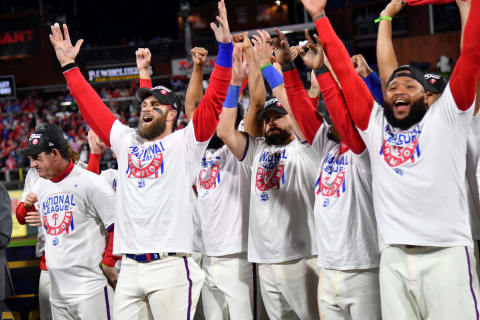 Oct 23, 2022; Philadelphia, Pennsylvania, USA; Philadelphia Phillies designated hitter Bryce Harper, left, and teammates celebrate after their 4-3 win over he San Diego Padres to win the National League Pennant in game five of the NLCS for the 2022 MLB Playoffs at Citizens Bank ParkMandatory Credit: Eric Hartline-USA TODAY Sports