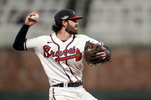 Oct 12, 2022; Atlanta, Georgia, USA; Atlanta Braves shortstop Dansby Swanson (7) fields the ball and throws out Philadelphia Phillies right fielder Nick Castellanos (8) at first base in the seventh inning during game two of the NLDS for the 2022 MLB Playoffs at Truist Park. Mandatory Credit: Dale Zanine-USA TODAY Sports