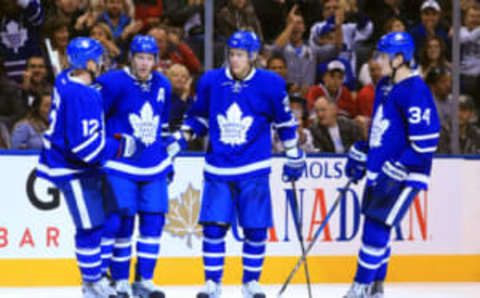 TORONTO, CANADA – OCTOBER 02: Nikita Zaitsev #22 of the Toronto Maple Leafs scores a goal and celebrates with Connor Brown #12, Matt Hunwick #2 and Auston Matthews #34 during an NHL preseason game against the Montreal Canadiens at Air Canada Centre on October 2, 2016 in Toronto, Canada. (Photo by Vaughn Ridley/Getty Images)