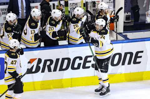 TORONTO, ONTARIO – AUGUST 17: Jake DeBrusk #74 of the Boston Bruins is congratulated by his teammates after scoring a goal against the Carolina Hurricanes during the third period in Game Four of the Eastern Conference First Round during the 2020 NHL Stanley Cup Playoffs at Scotiabank Arena on August 17, 2020 in Toronto, Ontario. (Photo by Elsa/Getty Images)