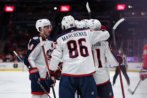 WASHINGTON, DC – OCTOBER 07: Kirill Marchenko #86 of the Columbus Blue Jackets celebrates with teammates after recording an assist on the eventual game-winning goal by Adam Fantilli #11 against the Washington Capitals during the third period of the NHL preseason game at Capital One Arena on October 7, 2023, in Washington, DC. (Photo by Scott Taetsch/Getty Images)