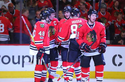 NHL Mid-Season Awards: Chicago Blackhawks center Jonathan Toews (19) celebrates with teammates after scoring a goal during the first period against the Carolina Hurricanes at the United Center. Mandatory Credit: Dennis Wierzbicki-USA TODAY Sports